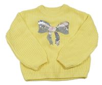 Žlutý žinylkový svetr s mašličkami z flitrů C&A