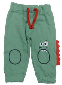 Zelené tepláky s příšerkou a ostny 