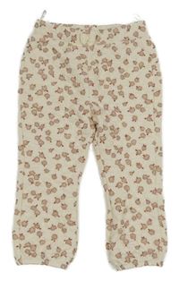 Smetanové květované prošívané tepláky C&A