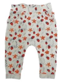 Bílé lehké baggy tepláky s kytičkami a jahůdkami Topomini