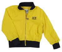 Žlutá šusťáková jarní bunda s nápisem 