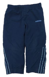 Tmavomodré šusťákové kalhoty Adidas