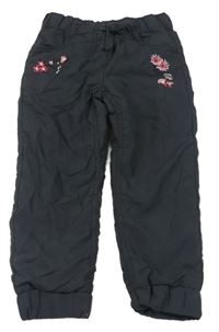Černé cuff šusťákové podšité kalhoty s kytičkami a muchomůrkami Topolino