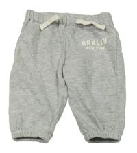 Světlešedé tepláky s nápisem H&M