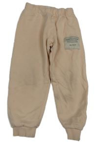 Světlepudrové crop tepláky s nášivkou Mainio