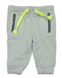 Světlešedé tepláky s kapsami 