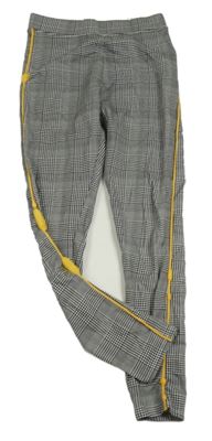 Černo-bílé kostkované legíny s pruhem H&M