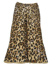 Hnědé vzorované flitrové flare podšité kalhoty River Island