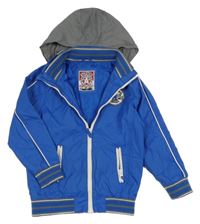 Modrá šusťáková jarní bunda s ukrývací kapucí Tu