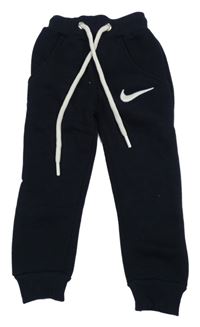 Tmavomodré teplé tepláky s logem Nike