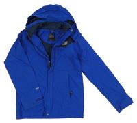 Safírovo-tmavomodrá šusťáková funkční jarní bunda s ukrývací kapucí Karrimor