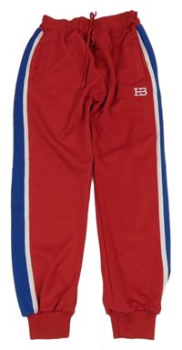 Červené sportovní tepláky s modrým pruhem 