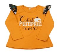 Oranžové triko s nápisem a volánky 