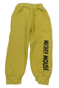 Okrové tepláky s nápisem 