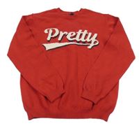 Červený svetr s nápisem Kiabi