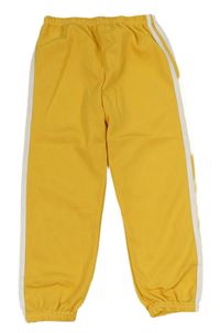 Okrové vzorované teplákové kalhoty s bílými pruhy