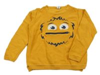 Okrový lehký svetr s příšerkou Dopodopo