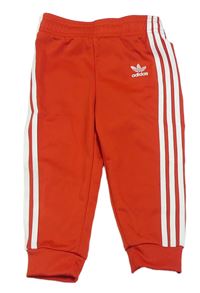 Červeno-bílé sportovní tepláky s pruhy Adidas