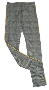 Černo-bílé kostkované legíny s pruhem H&M