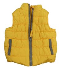 Žlutá šusťáková zateplená vesta Mothercare