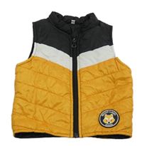 Černo-bílo-žlutá šusťáková zateplená vesta 