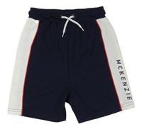 Tmavomodro-bílé sportovní kraťasy s logem McKenzie