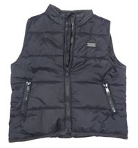 Tmavomodrá šusťáková zateplená prošívaná vesta Name it