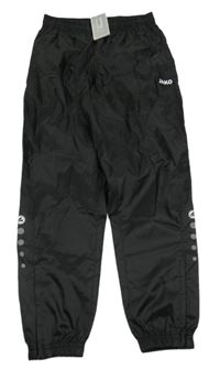 Nové - Černé šusťákové voděodolné kalhoty JAKO