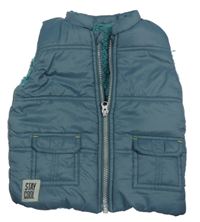 Tmavomodrá šusťáková zateplená vesta s nášivkou Nutmeg