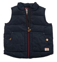 Tmavomodrá šusťáková zateplená vesta Next