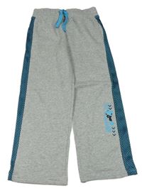 Šedé melírované tepláky se snowboardistou a černo-modrým vzorovaným pruhem Topolino