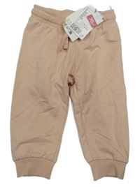 Nové - pudrové tepláky H&M