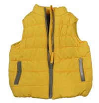 Hořčicová šusťáková zateplená vesta Mothercare