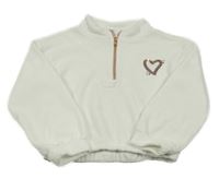 Bílý žinylkový svetr se srdcem z flitrů