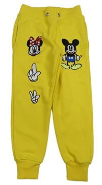 Žluté tepláky s Mickeym a Minnie 