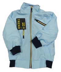 Světlemodro-tmavomodrá šusťáková jarní bunda s nášivkou donino