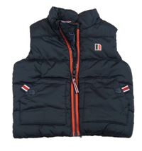 Tmavomodrá šusťáková zateplená vesta s červeným zipem Next