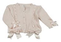 Světlerůžový propínací svetr s mašlemi