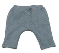 Modrošedé prošívané tepláky