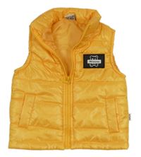 Pomerančová prošívaná šusťáková zateplená vesta s medvídkem