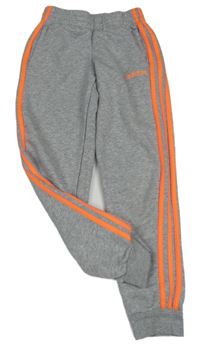 Šedo-neonově oranžové tepláky s logem Adidas