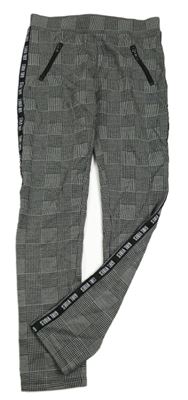 Černo-šedé kostkované tregíny se zipy C&A