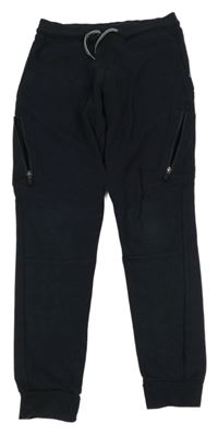 Tmavomodré tepláky s kapsami Okaidi