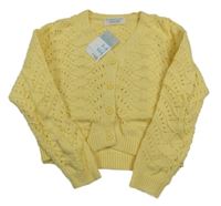 Nové - žlutý perforovaný propínací crop svetr Primark