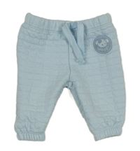 Světlemodré prošívané tepláky s pejskem 