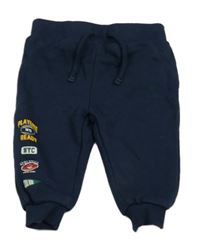 Tmavomodré tepláky s potiskem Primark