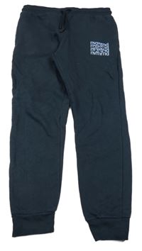 Tmavomodré tepláky s nápisy Destination 