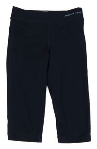 Tmavomodré capri sportovní legíny s nápisem TCM