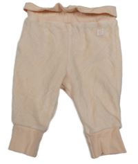 Růžové sametové tepláky s nášivkou