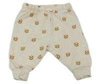 Světlebéžové, melírované tepláky s kytičkami PUSBLU